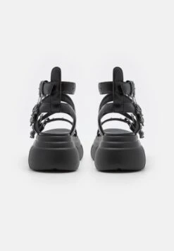 KOI FOOTWEAR Raining Vengeance Charm Platform - Platform Sandals -Fashion Clothing Specialty Store 36456e37e2934e2ead7aeddaa63c366b