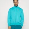 Nike Performance Heritage - Training Jacket - Teal -Fashion Clothing Specialty Store 98149e1d031246e0bfd9ed0f145741c9